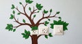 Creative tree wall decal incorporating electrical outlets and light switch Royalty Free Stock Photo