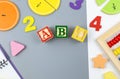 Creative trendy colors ABC, numbers, shapes, fractions on gray background. Interesting funny preschool games.