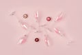 Creative trendy flat lay with champagne flutes filled with pink heart shaped confetti and chocolate candy on pastel Royalty Free Stock Photo