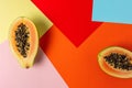 Creative tropical layout with papaya on colorful vivid paper. Minimal abstract summer concept. Flat lay