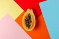 Creative tropical layout with papaya on colorful vivid paper. Minimal abstract summer concept. Flat lay