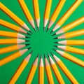Creative Unity - Yellow Pencils in a Circle on Green Royalty Free Stock Photo