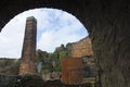 View of a brick chimney from an opening in a Beehive Brick Kiln, Porth Wen Brickworks, Anglesey