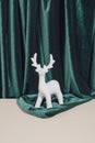 Creative Vintage Art Direction. Minimal New Year Or Christmas Composition With With Reindeer Ornament On Green And Sand Coloured