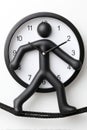 Creative wall clock with human figure design and unique time display Royalty Free Stock Photo