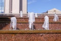 Creative water feature design ideas for waterfall fountain on stairway of entrance group of building.