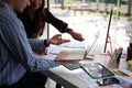 Creative web designer brainstorming about mobile app interface wireframe design on table at office. Royalty Free Stock Photo