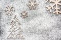 Creative winter snowflakes and fir-tree from powdered sugar Christmas and New Year backgrounds. Royalty Free Stock Photo