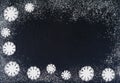 Creative winter snowflakes from powdered sugar background. Christmas and New Year backgrounds.