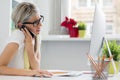 Creative woman talking on phone in the office Royalty Free Stock Photo