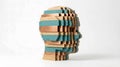 Creative wooden block sculpture forming a human head profile with geometric and layered design elements Royalty Free Stock Photo