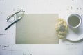 .Creative work concept.Mock-up blank craft sheet of empty paper, pen, eye glasses and morning coffee cup with croissant Royalty Free Stock Photo