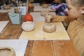 creative workshop on Halloween day on pumpkin modeling from clay Royalty Free Stock Photo