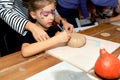 creative workshop on Halloween day on pumpkin modeling from clay Royalty Free Stock Photo