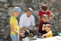 Creative workshop of traditional handcrafts - potter teaches children how to make pottery on potterÃÂ´s wheel