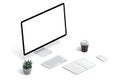 Creative workspace with computer display mockup, keyboard, plant, coffee, mouse and pad