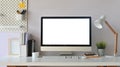 Creative Workspace. White blank screen computer on Office working desk. Equipment on table. Royalty Free Stock Photo