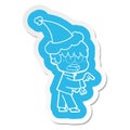 A creative worried cartoon sticker of a boy wearing santa hat