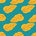 Creative yellow leaves seamless pattern on green background. Simple leaf endless wallpaper Royalty Free Stock Photo