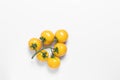 Creative yellow tomatoes on white isolated background