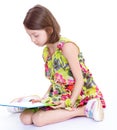 Creative young girl looking photo album. Royalty Free Stock Photo