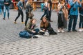 Prague, October 28, 2017: Creative young girls - artists paint pictures on the street next to the Prague Castle