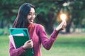 Creative young woman hold shinning light bulb. Royalty Free Stock Photo