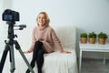 Creative young woman recording video blog for social media network. Royalty Free Stock Photo