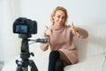 Creative young woman recording video blog for social media network. Royalty Free Stock Photo