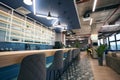 Creative zoning in a modern coworking space, stylish bar area