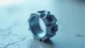 3D-Printed Jewelry Unique geometric ring designed with intricate shapes and textures placed on a textured surface Royalty Free Stock Photo