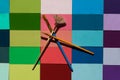 Creatively placed paint brushes on bright tiles