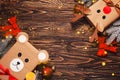 Creatively wrapped Christmas gifts in the shape of a teddy bear and a deer. New Year and Christmas concept. DIY gift wrapping.