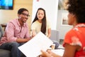 Creatives Having Informal Meeting On Sofas In Design Studio Royalty Free Stock Photo
