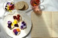 Creativity concept photography with edible flowers sandwich and creative writing notebook