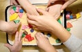 Children playing with kinetic sand, croup and designer in preschool. The development of fine motor concept. Creativity Game Royalty Free Stock Photo