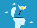 Creativity and imagination. A winged light bulb flies a businessman out of a human head Royalty Free Stock Photo