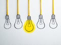 Creativity and innovation represented by illuminated and unlit light bulb sketches with yellow accents Royalty Free Stock Photo