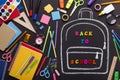 Creativity mess of school supplies and chalk painted backpack Royalty Free Stock Photo