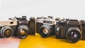 Creativity Retro Technology Concept. Vintage Film Cameras On Yellow And Pink Background, Front View Royalty Free Stock Photo