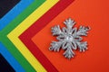 Abstract texture on a colorful background lies a snowflake Royalty Free Stock Photo