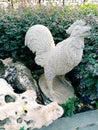 Creativity of a stone rooster statue. A rooster is an animal that represents strength, a symbol of hard work and a fighting spirit
