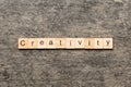 creativity word written on wood block. creativity text on cement table for your desing, concept Royalty Free Stock Photo