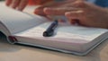 Creator fingers opening notebook table workplace close up. Author hands writing Royalty Free Stock Photo