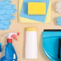 Creatve cleaning tools layout on pastel beige background. Flat lay