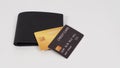 Credit card Black and gold color in black on wallet isolated on white background Royalty Free Stock Photo