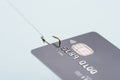 Credit card on fishing hook fraud data leak money stealing phishing Royalty Free Stock Photo