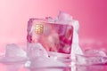 Credit card frozen in ice cube. Frozen bank account. Frozen funds and assets, unavailable money. The concept of bankruptcy and Royalty Free Stock Photo