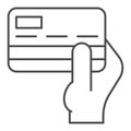 Credit card in hand thin line icon. Person holding pay operation item symbol, outline style pictogram on white Royalty Free Stock Photo