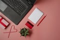 Credit card, laptop and christmas presents on pink background flat lay, copy space. Christmas shopping Royalty Free Stock Photo